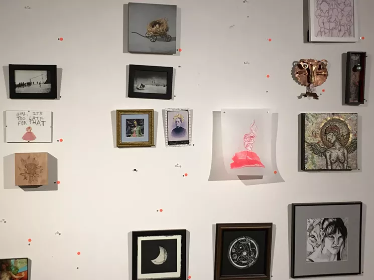 Exhibit wall, minus lots of sold artwork, during opening night for "Nasty Women: Phoenix Unite." - LYNN TRIMBLE