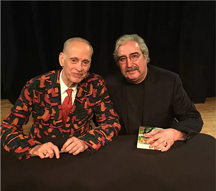 August and transgressive film director John Waters, at a book signing for the latter in December. - COURTESY OF THE FAMILY OF JACK AUGUST JR.
