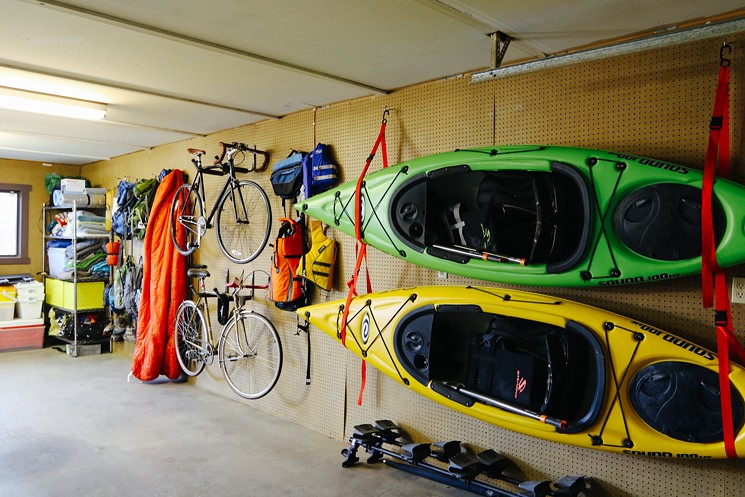 The gear wall in the garage is the couple's pride and joy. - EVIE CARPENTER