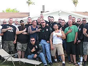 Right front in white wife beater, Ricci and fellow Vinlanders throw up the group's hand sign, based on an obscene gesture. - MARICOPA COUNTY SUPERIOR COURT