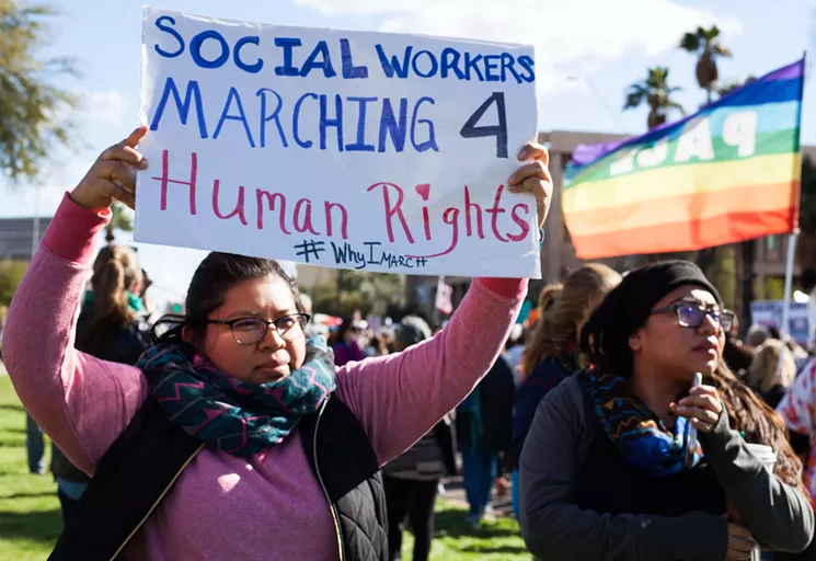 Mayra Alvarado (left) and Estrellita Alvarado protest at the Women's March on Phoenix. - MARIA ESQUINCA