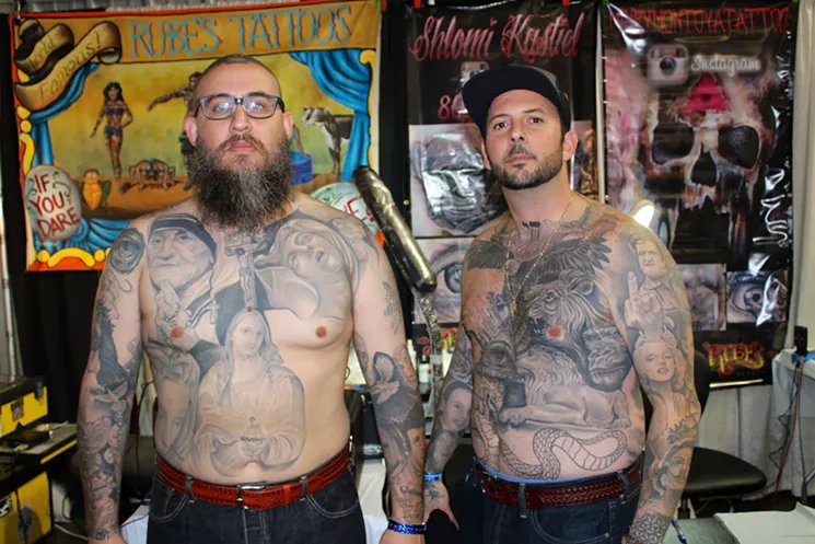 Juice, left, and Shlomi Kastiel of Rube's Tattoo in Arcadia, California, show off their black and white portraits done by coworker Mikey Montoya. - JUSTIN CRIADO