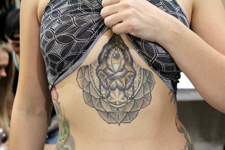 Kris Nelson shows off her underbust tattoo by Sam Corser of 2nd Street Tattoo in Prescott Valley. - JUSTIN CRIADO