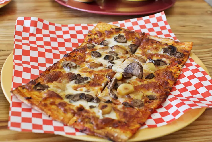 The Gram pizza at Saffron JAK is baked mushrooms and whole cloves of sweet roasted garlic on sangak bread crust. - STEPHANIE FUNK