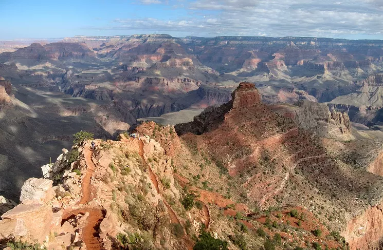 Although a faster route to the bottom of the Canyon, South Kaibab Trail is filled with steep plunging ridgeline switchbacks like this. Water and emergency phones are not available on this trail, and rangers and shady areas are rare. - NPS PHOTO BY MICHAEL QUINN/FLICKR CREATIVE COMMONS