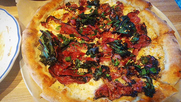 The crispy pastrami pizza at Doughbird is clever and inventive — if a bit on the greasy side. - PATRICIA ESCARCEGA