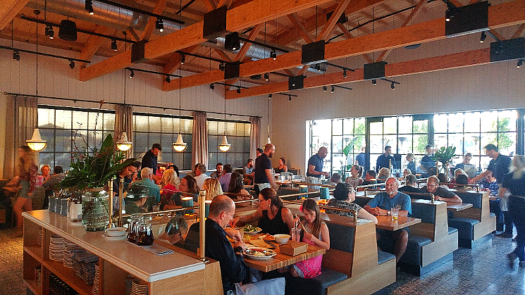 The dining room at Doughbird is modern and lively, with a beachy, Northern California-inspired design. - PATRICIA ESCARCEGA