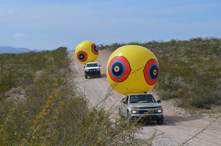 Artist Raven Chacon leads Douglas, Arizona, volunteers in taking balloons into the desert in October 2015. - LYNN TRIMBLE