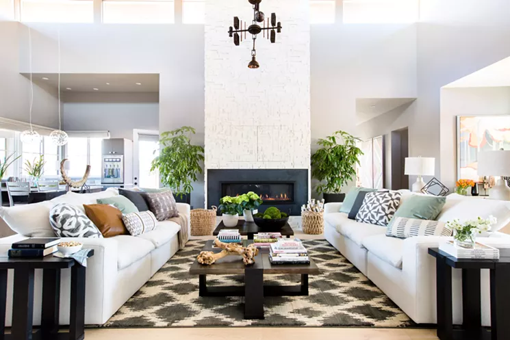 At the heart of the home is a vaulted-ceiling great room featuring a modern, textural fireplace centerpiece. - BRITTANY AMBRIDGE/COURTESY OF HGTV