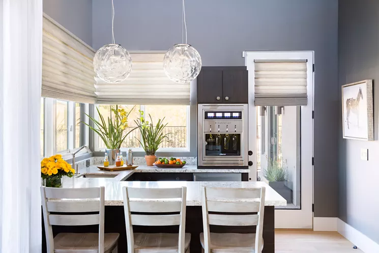 In addition to its many gadgets and gizmos, the home has a three-car garage, home office, pantry and laundry area, a pool, and this oversized wet bar. - BRITTANY AMBRIDGE/COURTESY OF HGTV