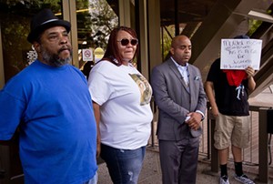 Fred Franklin, Sarah Coleman, Jarrett Maupin, and an anonymous man delivered an emotional plea for public support at Tempe City Hall on Thursday following the decision to clear the officer who shot Dalvin Hollins, Coleman and Franklin's son. - TOM CARLSON