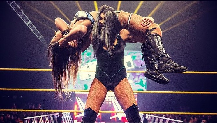 Ember Moon dishes out some pain to Asuka at an NXT live event last year. - SABRE BLADE/FLICKR CREATIVE COMMONS