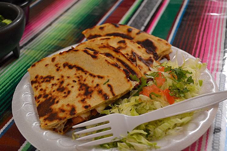 An al pastor-stuffed quesadilla at Tacos Sahuaro. The restaurant's quesadillas, sopes, and gorditas are made from scratch daily. - PATRICIA ESCARCEGA