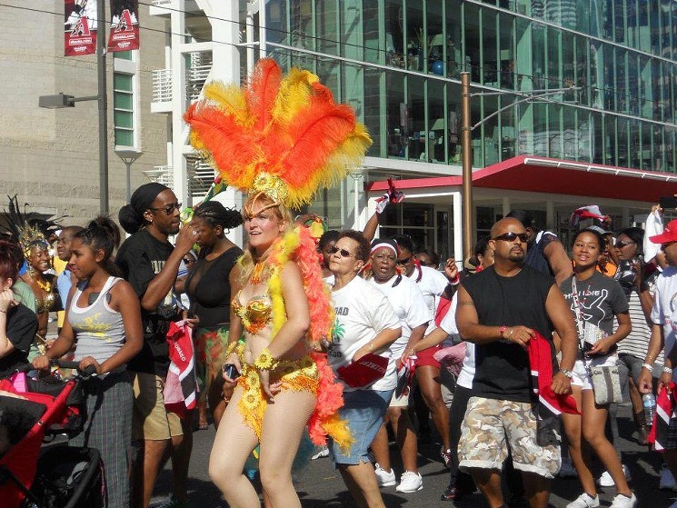 The Phoenix Caribbean Carnival’s downtown street parade features dancers and bands in traditional clothing. - CARIBBEAN AMERICAN PHOENIX CARNIVAL CULTURAL ASSOCIATION OF ARIZONA