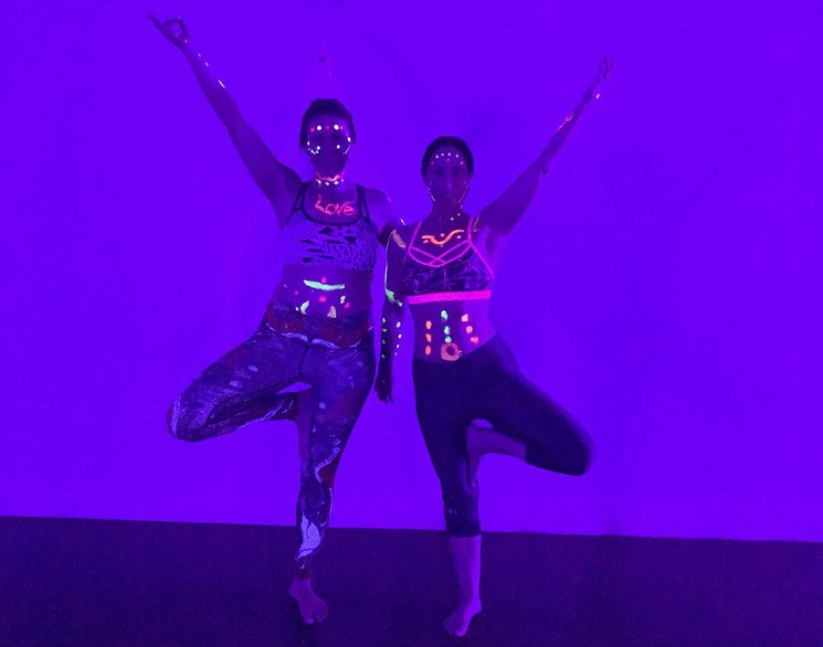 During Floo-id Yoga’s Glow with the Flow sessions, practitioners can wear glow-in-the-dark paint and bracelets while practicing poses. - KARLI HORNER