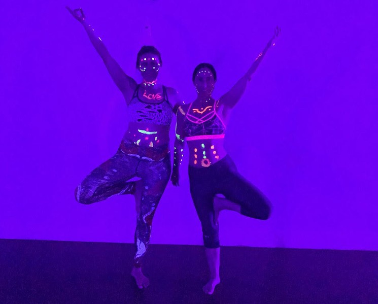 During Floo-id Yoga’s Glow with the Flow sessions, practitioners can wear glow-in-the-dark paint and bracelets while practicing poses. - KARLI HORNER