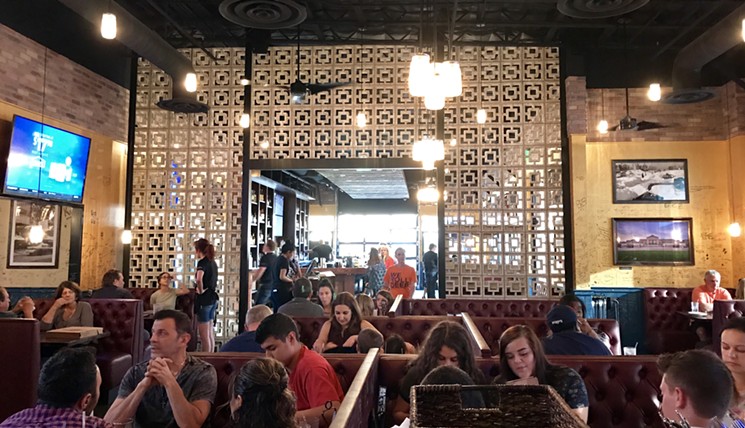 The simple, casual restaurant has endeared itself to the neighborhood, employing familiar concrete brickwork and encouraging patrons to sign the walls after their meal. - MELISSA CAMPANA
