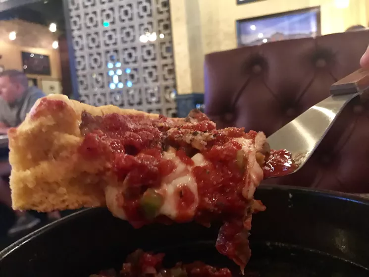 Gino's Supreme with sausage, peppers, onions, and mushrooms dotting the cheesy, tomato-y landscape. - MELISSA CAMPANA