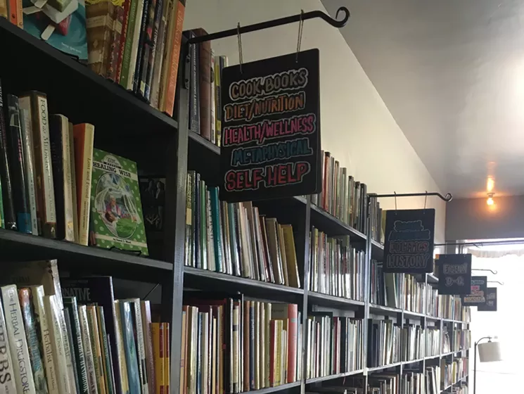 The bilingual bookstore, Palabras, inside the McDowell Market, offers Spanish and English language classes. - FELICIA CAMPBELL