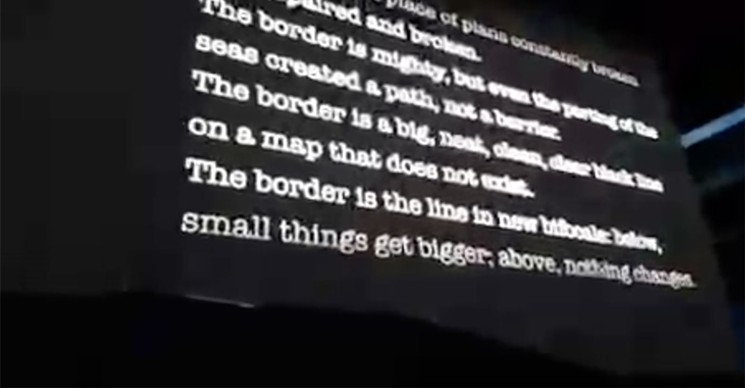 Screenshot of Alberto Ríos poetry on a giant screen at a 2017 U2 concert. - COURTESY OF ASU