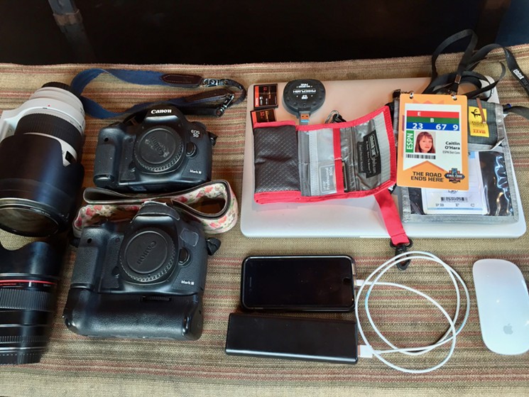 The many items of O'Hara's camera bag. - LAUREN CUSIMANO