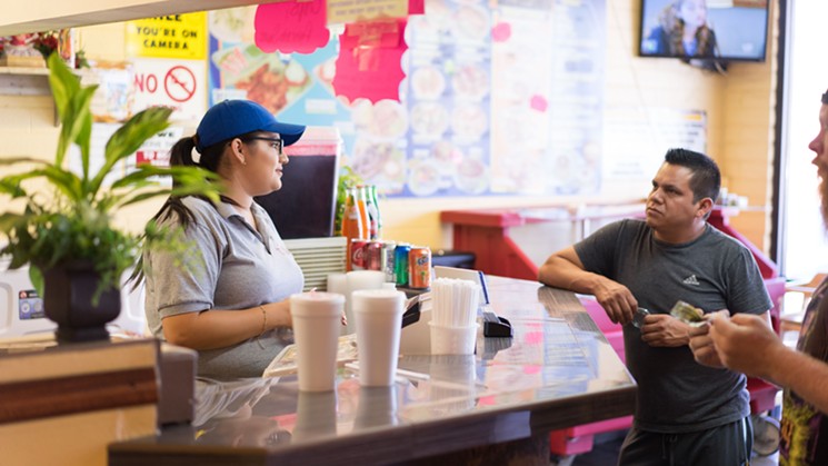 The big menu at Tacos Jalisco spans two walls, but the most popular order is the carne asada. - SHELBY MOORE