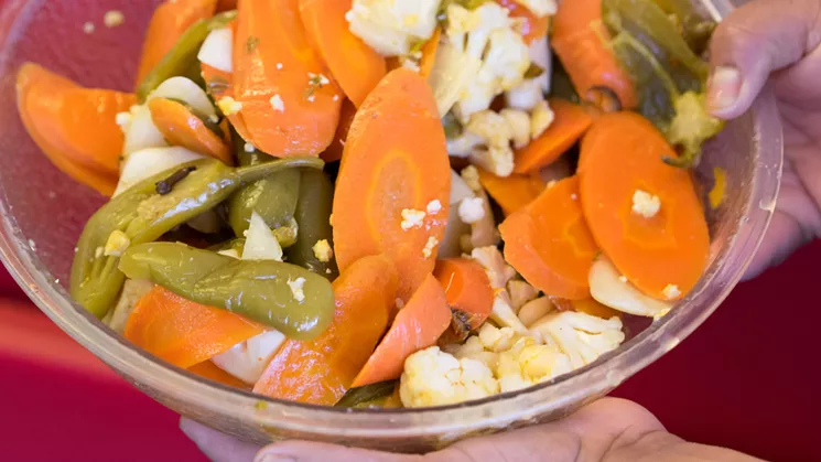 Owner Patricia Alvarez is proud of her house-made spicy pickled carrot mix, with cauliflower and jalapeño, that the staff mixes in large quantities using big plastic bins. - SHELBY MOORE