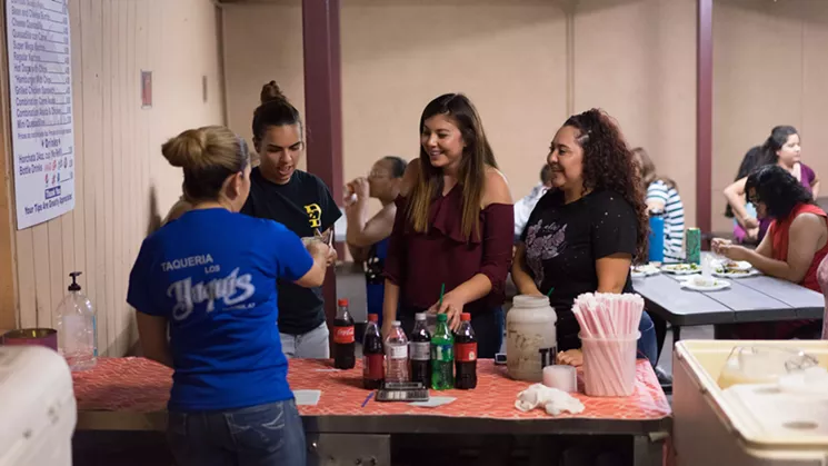 While a party rages on inside Charlie's, diners who line up on the exterior patio often are high school and college students and families who live in the neighborhoods around Melrose. - SHELBY MOORE