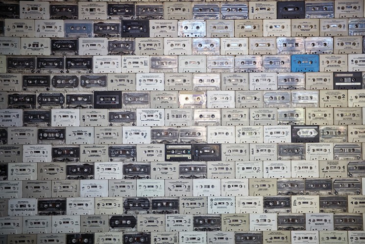 Fans of Upward Projects restaurants provided hundreds of old cassettes to create this conversation wall at Windsor. - DAVID B. MOORE