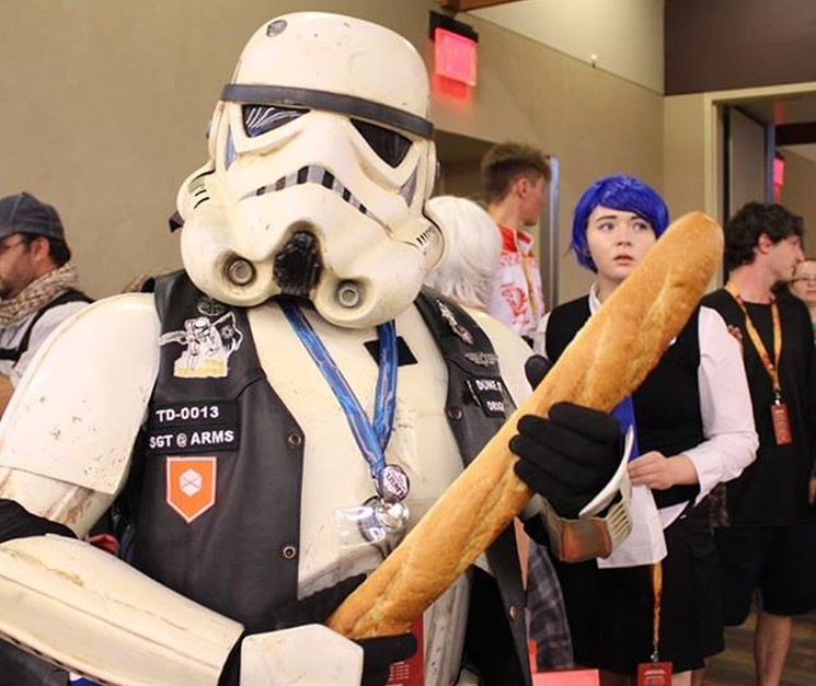 Kevin O'Connor, emcee of Phoenix Comicon's Masquerade, with a baguette instead of a rifle at this year's event. - NICKOLE RINDE