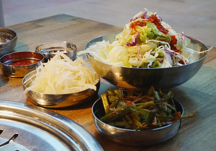 Dinners at Sizzle Korean Barbecue in Phoenix come with a side salad dressed in gochujang and chopped onions and scallions to pair with grilled meats. - MEAGAN MASTRIANI