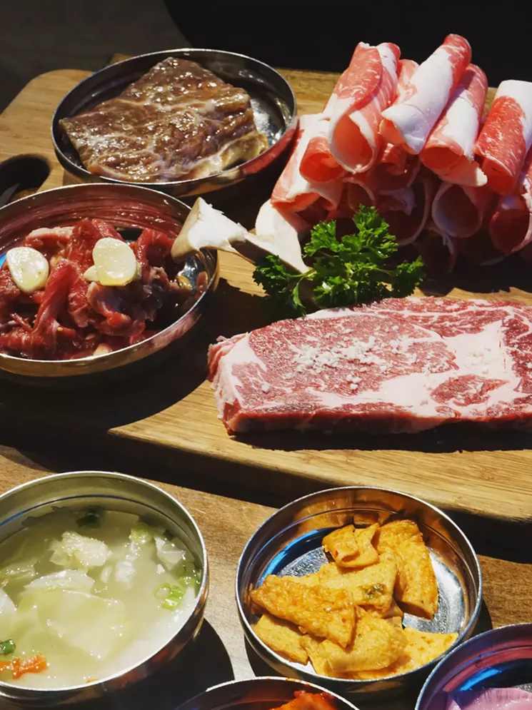 The beef combo at Sizzle Korean Barbecue in Phoenix includes four cuts of meat, a stew, and various side dishes. - MEAGAN MASTRIANI