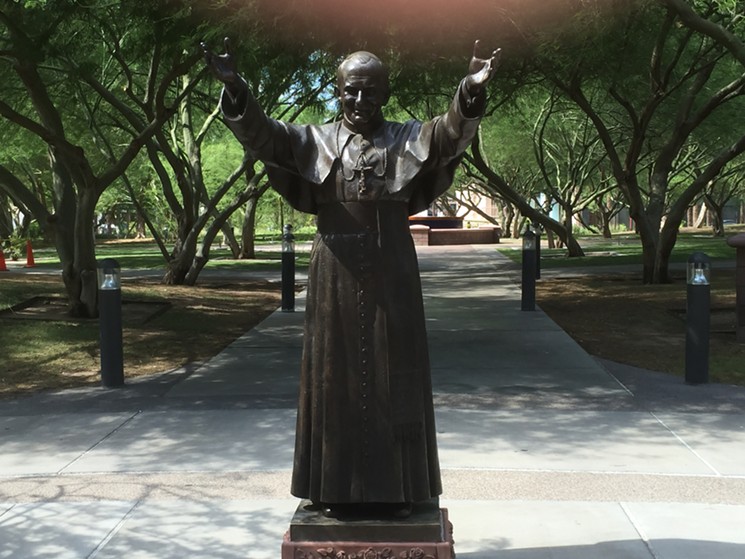 A statue of Pope John Paul II welcomes visitors to the Diocese of Phoenix, which is named in a new lawsuit by an alleged sexual assault victim - STUART WARNER