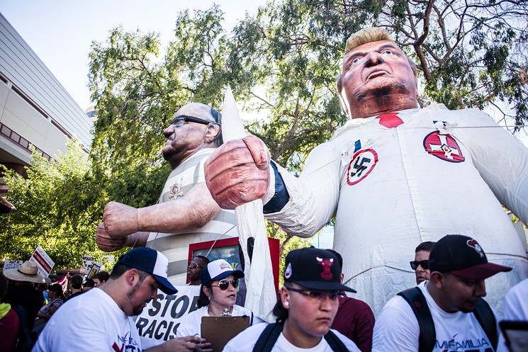 Demonstrators filled the streets at the Phoenix rally to protest Trump's policies and his promised pardon for Joe Arpaio. - ZEE PERALTA