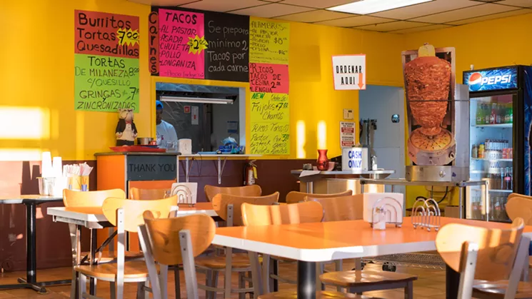 Don't let the Al Pastor cardboard cut-out fool you — there's a real one spinning in the kitchen. - SHELBY MOORE