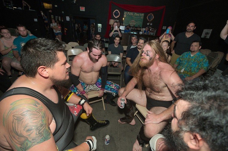 Wrestlers getting into a combination drinking and punching contest at  Party Hard's debut show last year. - BENJAMIN LEATHERMAN
