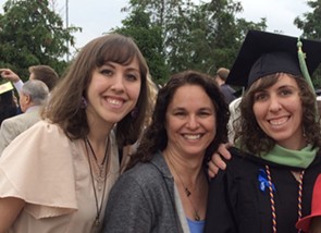 Coslett, center, at a 2015 graduation ceremony with her daughters, now 25 and 28. - COURTESY OF LISA COSLETT