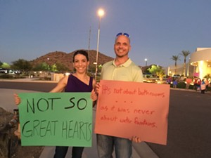 Sonja Stone and Stu Kemppainen protest Great Hearts' anti-transgender policy. - MOLLY LONGMAN