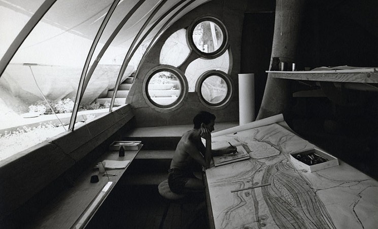 Stuart A. Weiner, Soleri sketching at his desk, Cosanti, ca. 1960. Gelatin-silver print, 10 x 8 inches. Collection of the Costanti Foundation. Copyright: The Weiner Estate. - COURTESY OF SCOTTSDALE MUSEUM OF CONTEMPORARY ART