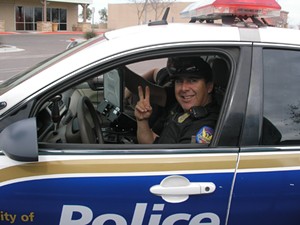 Albert Salaiz, shown here at another date in his Phoenix PD patrol car, was the first police officer on the scene the day Ame Deal was found murdered. - COURTESY ALBERT SALAIZ