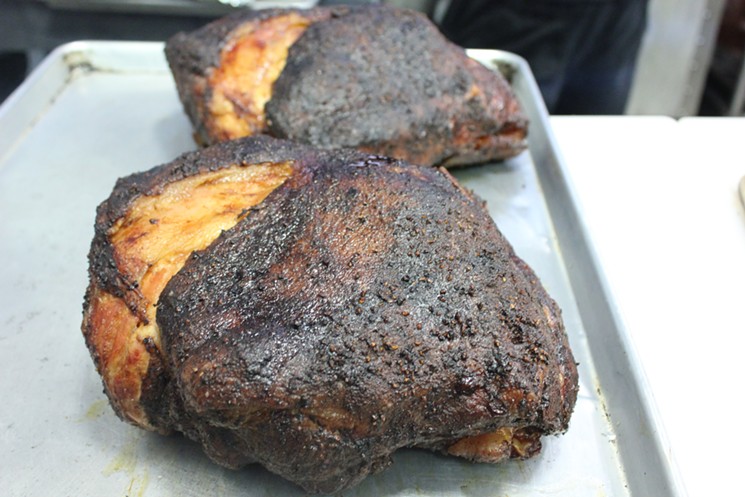 Smoked pork butts ready to be pulled at Naked Q. - CHRIS MALLOY