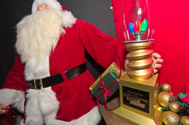 The Birkett's Great Christmas Light Fight trophy on display at their Scottsdale home. - BENJAMIN LEATHERMAN