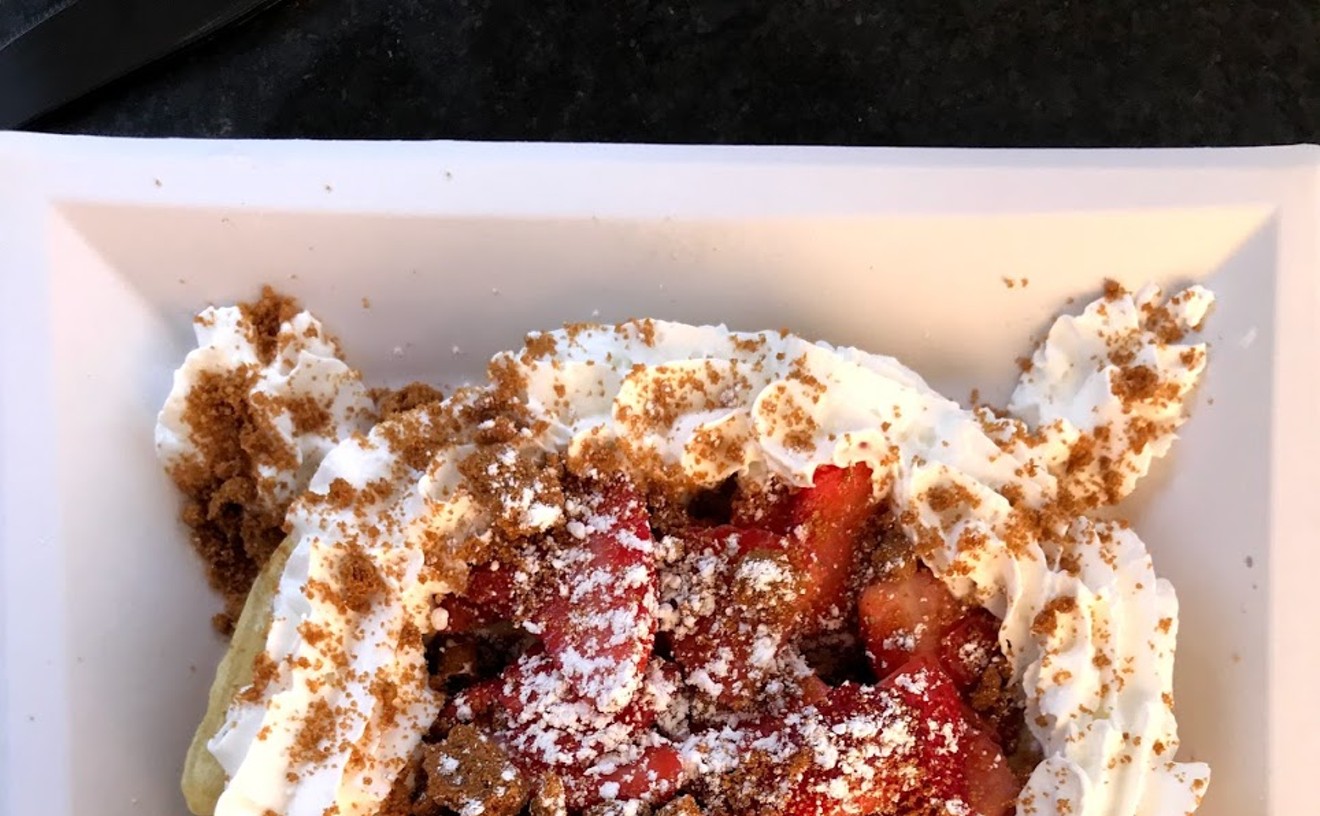 The strawberry "shortcrepe" is topped with whipped cream, strawberries, and biscotti crumbs.