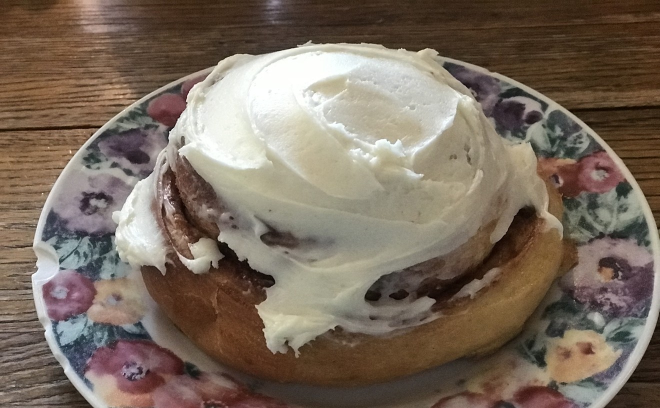 The cream cheese frosting perfectly covers the top of this cinnamon roll at Lux Central.