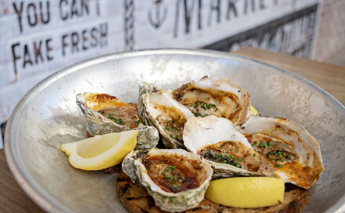 Grilled oysters from Chula Seafood Uptown are finished with bourbon-chipotle butter.