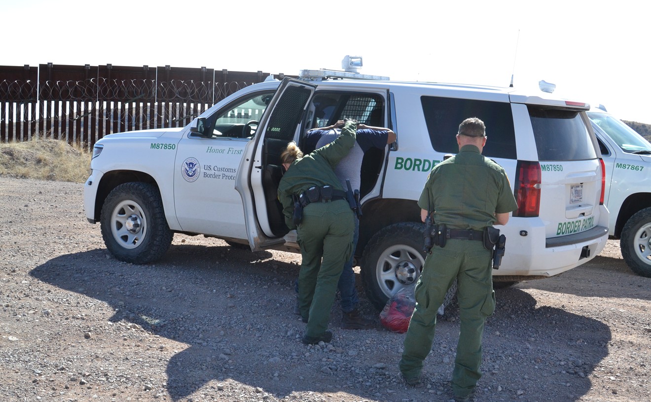 Border Patrol arrests a migrant who had jumped over the border fence near Nogales on February 12, 2019.