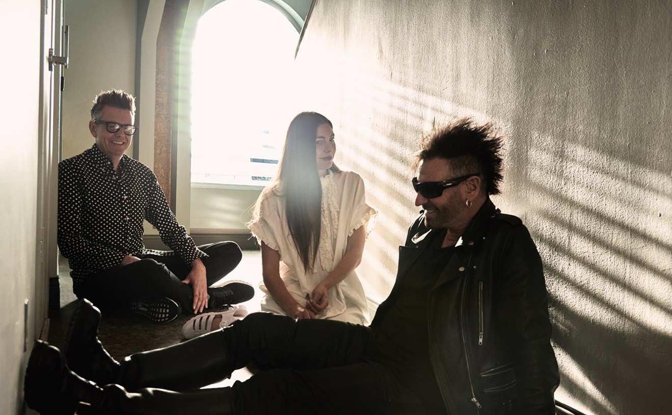 Poptone bathed in the light of a new day. Daniel Ash in the foreground with bandmates Diva Dompe and Kevin Haskins to his right.