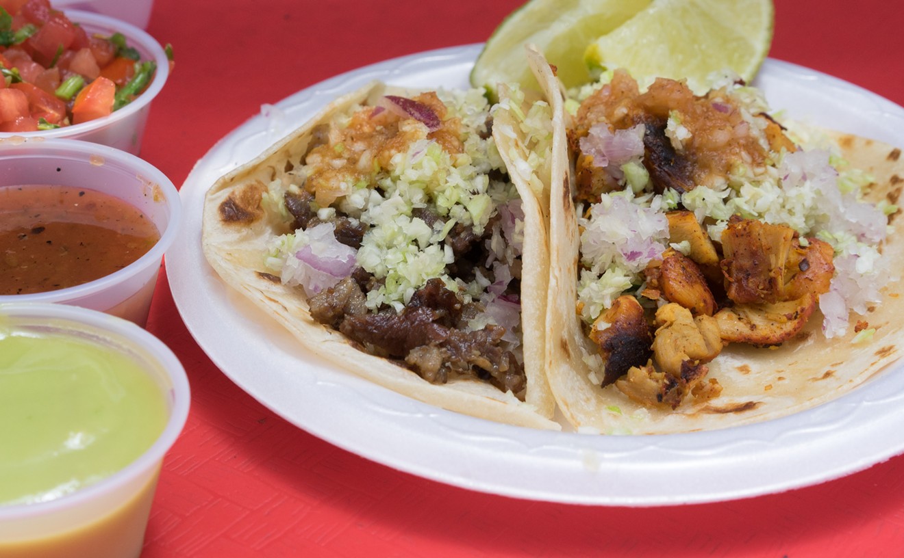 Each taco comes with minced cabbage and onion, plus a mild, smoky red salsa.