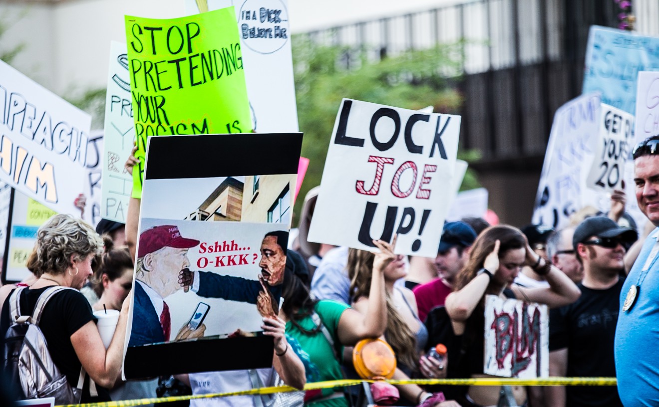 "Lock Joe Up" signs were spotted all around the Phoenix Convention Center when Trump visited.