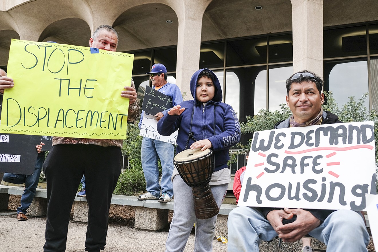 Residents of three Phoenix mobile home parks and their supporters protested at a City Council meeting on March 22.